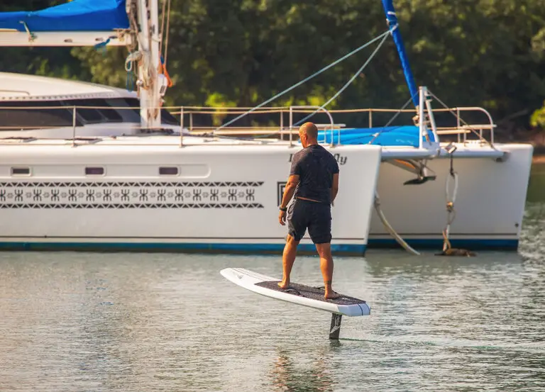 man hydrofoiling without waves